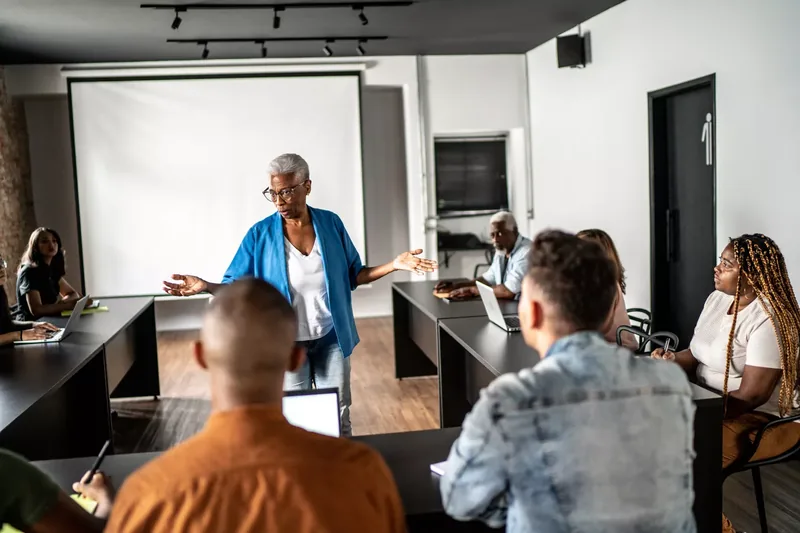Senior woman teaching in a classroom or seminar