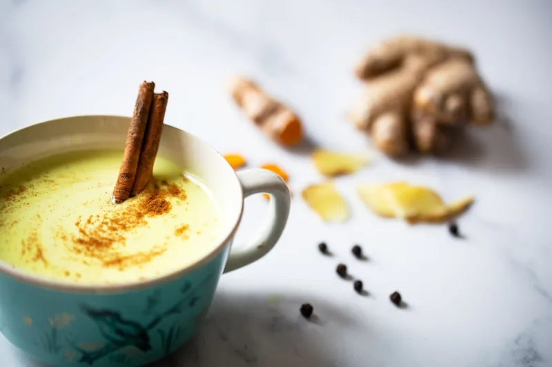 turmeric latte with a cinnamon stick