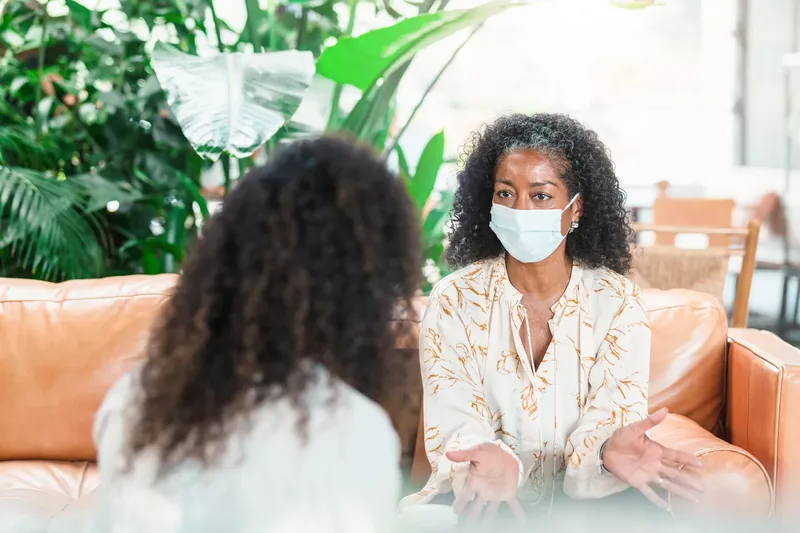 therapist talking to their client